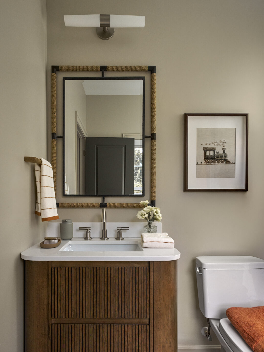 Millwood Road nursery bath vanity with rope-framed mirror and train print