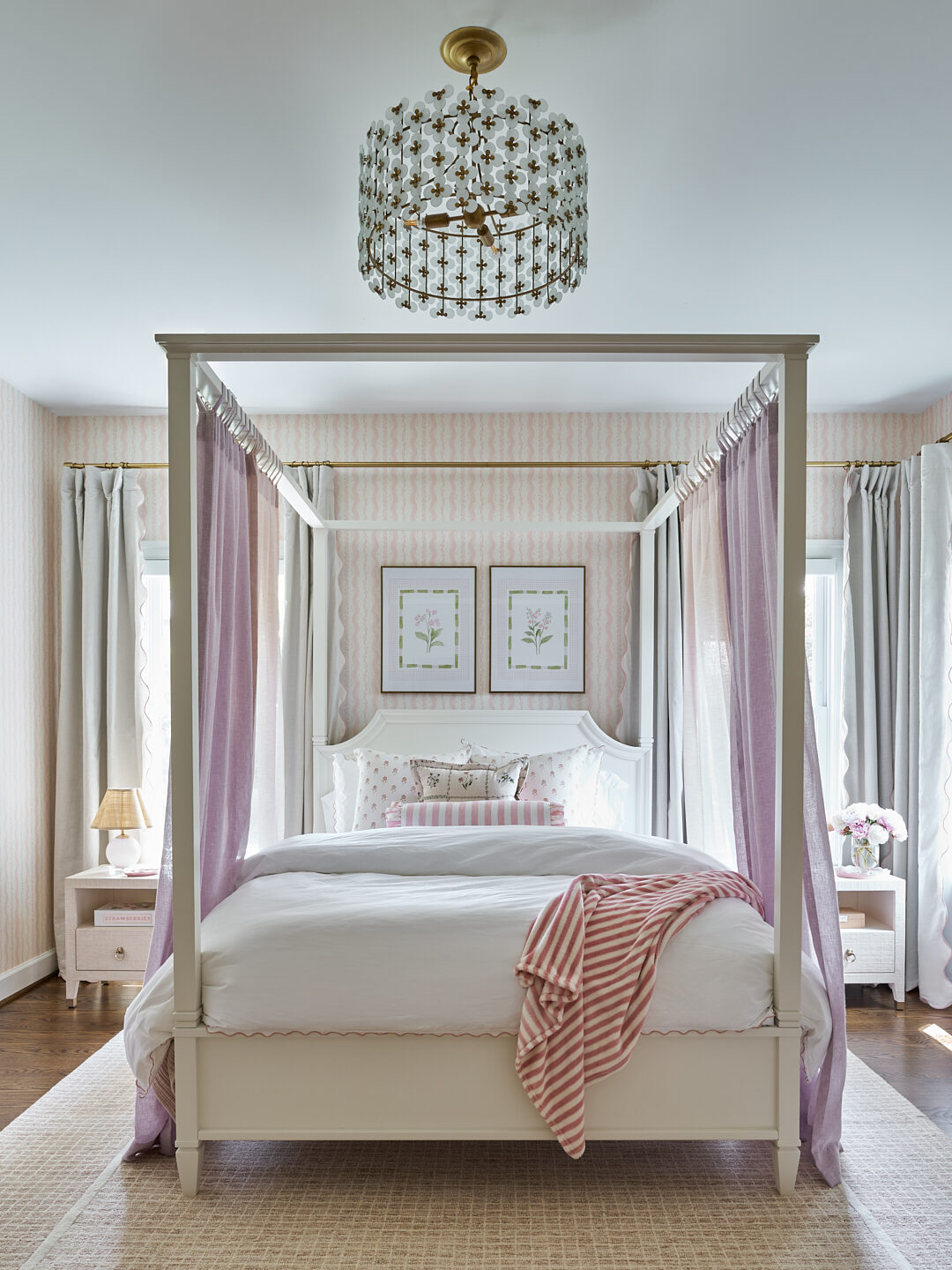 Millwood Road girl's bedroom canopy bed with lavender linen panels and floral chandelier