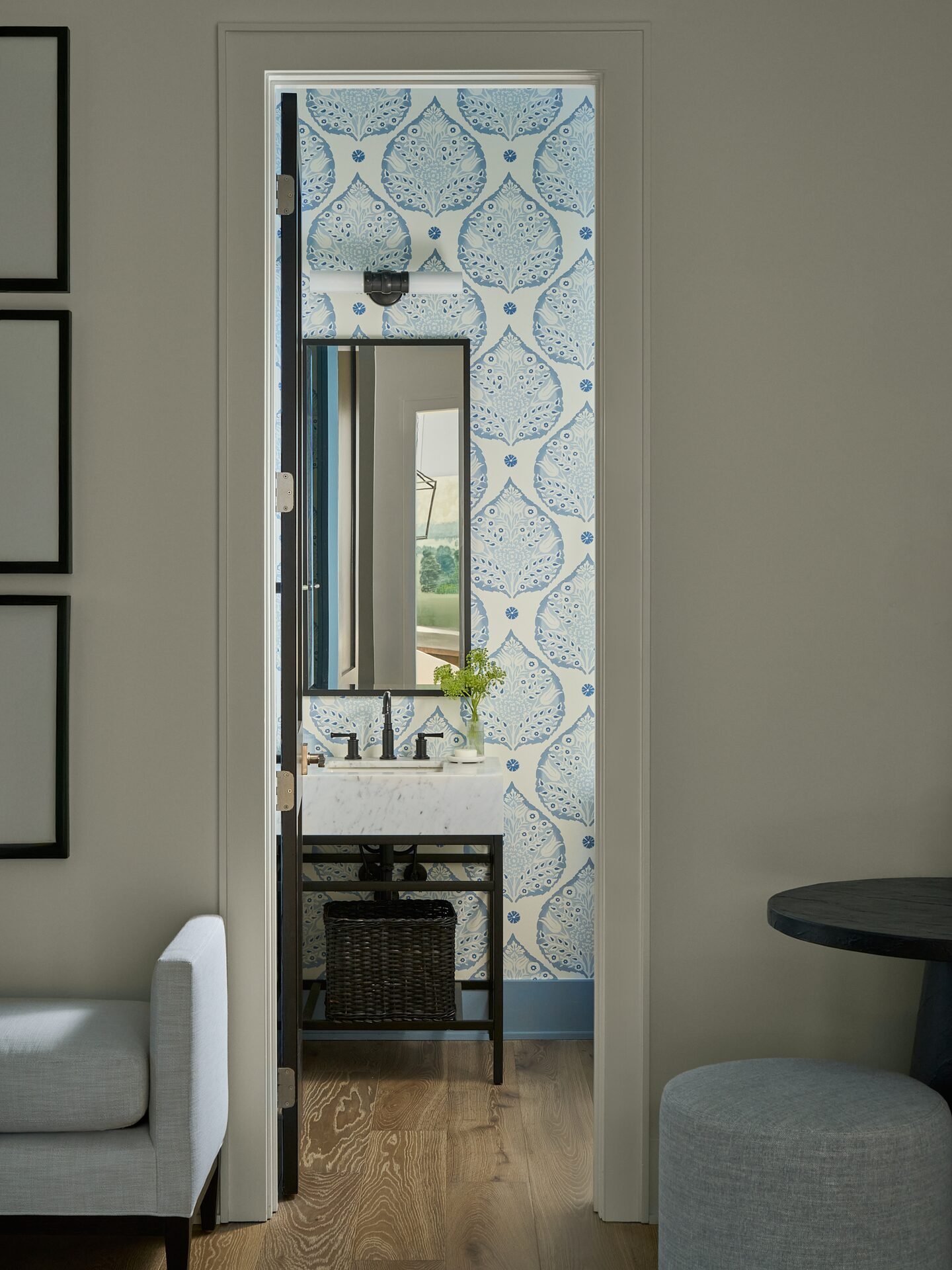 Worthington Road powder room with bold wallcovering and sculptural sconce